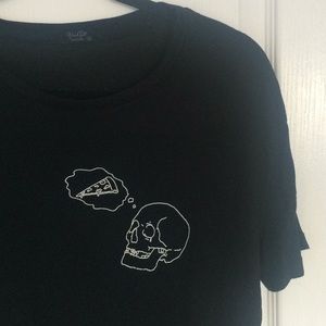 skeleton thinking about pizza top